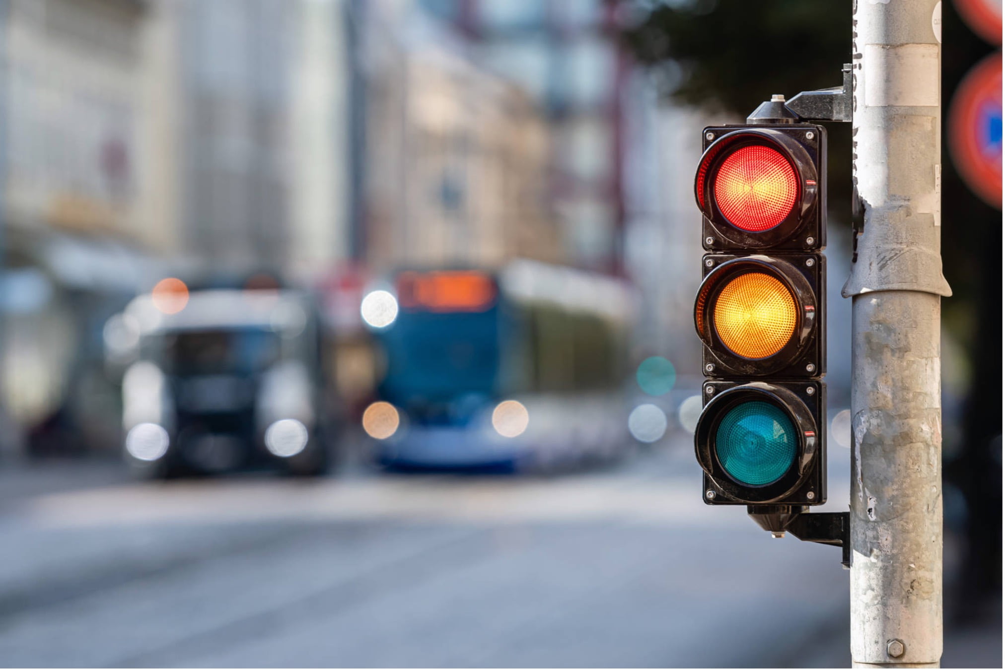 Traffic Lights With Bus In Background