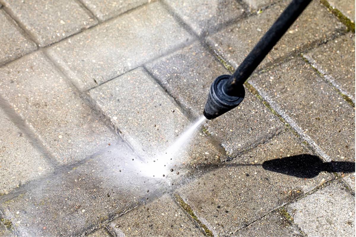 Close-up Of A Waterblaster Being Used On Concrete